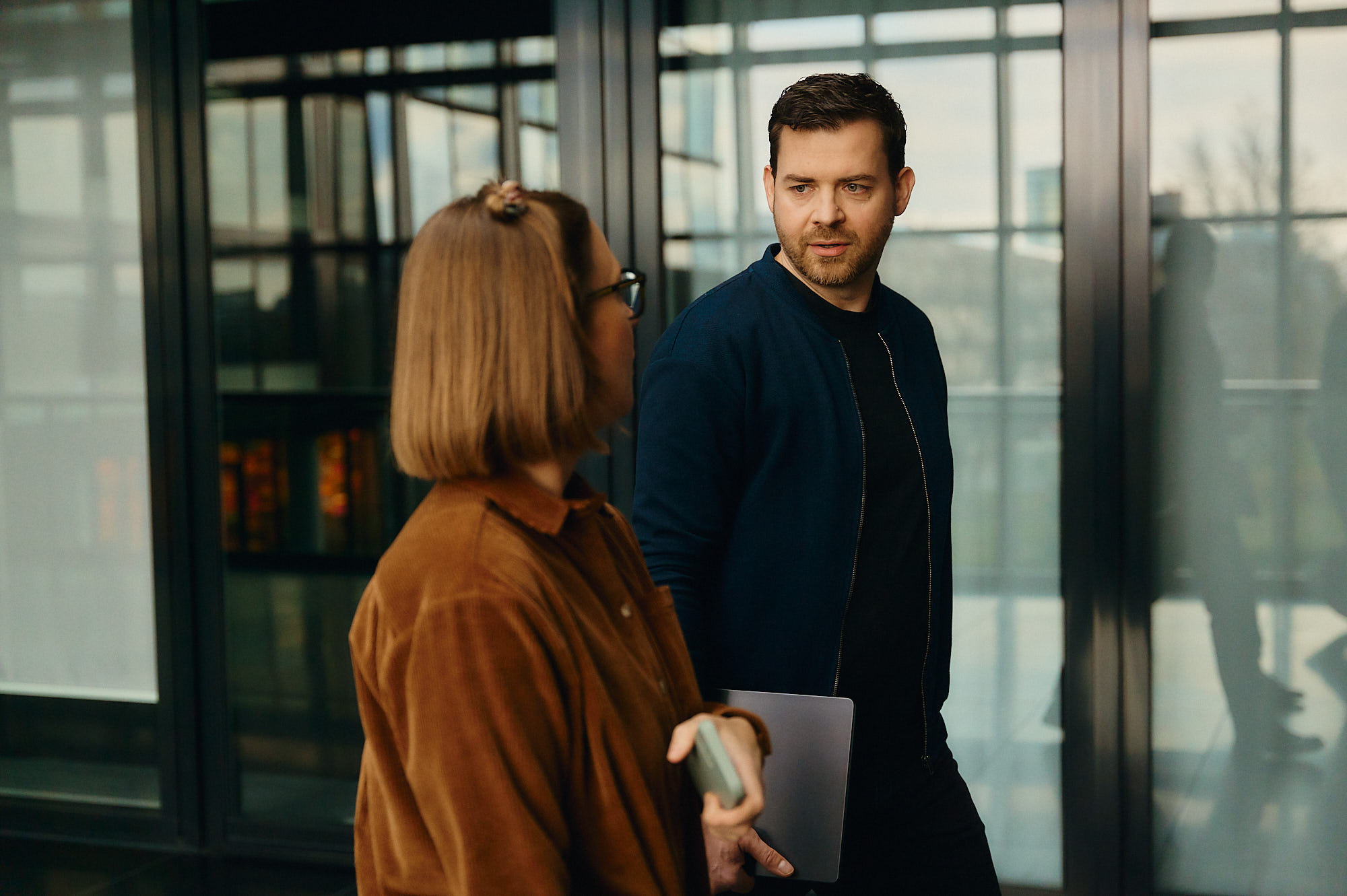 Antonio Merker in conversation with a colleague